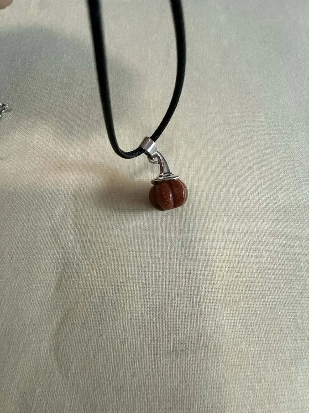 Goldstone Pumpkin Pendant Necklace on Black Cord